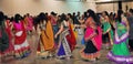 Men and women are dancing and enjoying Hindu festival of Navratri Garba wearing traditional consume.