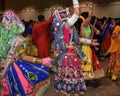 Girls, man and women are wearing traditional Indian folk dress during Navratri festival garba and dandiya dance in Canada, 2018