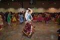 Girls, man and women are wearing traditional Indian folk dress during Navratri festival garba and dandiya dance in Canada, 2018