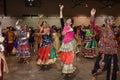 Girls, Man, women are performing garba and dandiya dance wearing traditional Indian folk dress during Navratri festival,Canada