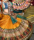 Girls, Man, women are performing garba and dandiya dance wearing traditional Indian folk dress during Navratri festival,Canada Royalty Free Stock Photo