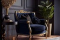 navy blue armchair with golden frame against dark wall with molding in elegant living room interior Royalty Free Stock Photo