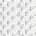 Navy blue colored snowdrop silhouettes seamless doodle pattern. Light grey background. Bloom flowers shapes Royalty Free Stock Photo