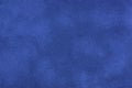 Navy blue matte background of suede fabric, closeup. Velvet texture of textile Royalty Free Stock Photo