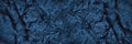 Navy blue rock texture. Toned mountain surface. Close-up. Dark stone background with copy space for design. Royalty Free Stock Photo
