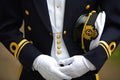 Navy Officer Holding his Cap