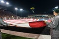 A Navy SEALs parachutes into Reser Stadium