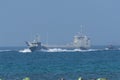 Navy warship fleet speed through the gulf water towards shore in combat and war. Military navy concepts