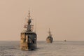 Navy warship fleet underway in formation in the sea when sundown Royalty Free Stock Photo