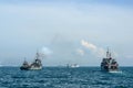 Navy warships gunning salute on sea in international fleet review drill