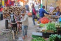 NAWALGARH, RAJASTHAN, INDIA - DECEMBER 26, 2017: Colorful street scene at the vegetable market with a carriage overloaded with woo