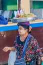 NAWNGHKIO, MYANMAR - NOVEMBER 30, 2016: Snack vendor on the train station in Nawnghkio Naunghkio, Naungcho or Nawngcho near