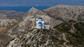 Naxos, Greece - August 5, 2019: For the islands of the cyclades typical christian chapel in the mountains of Naxos island. White Royalty Free Stock Photo