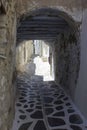 Small alley in Naxos Chora, with an arched tunner Royalty Free Stock Photo