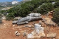 Broken statue lying on the ground. Called Kouros.  at Melanes traditional village in Naxos. Greece. Royalty Free Stock Photo