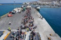 NAXOS, GREECE - SEPTEMBER 17, 2016: Passengers and cars embark on a ship at the port of Naxos in Greece.