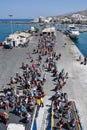 NAXOS, GREECE - SEPTEMBER 17, 2016: Passengers and cars embark on a ship at the port of Naxos in Greece.