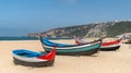 Colorful traditional old wooden fishing boat on the beach of fishing village of Nazare Royalty Free Stock Photo