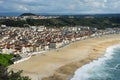 Breathtaking view of the small tourist town of Nazare, Portugal. View from above on small town, deserted beach and the Royalty Free Stock Photo