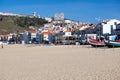 Nazare, Portugal - November 5, 2017: colorful traditional old wooden fishing boat on the beach of fishing village of Nazare . Royalty Free Stock Photo