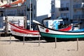 Nazare, Portugal - November 5, 2017: colorful traditional old wooden fishing boat on the beach of fishing village of Nazare . Royalty Free Stock Photo