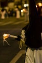 Nazarene with candle in the brotherhood procession