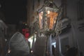 Nazarene in a procession at the holy week holding a candle