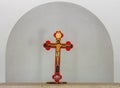 A cross with a crucifix stands on a table in an old chapel in the catholic Christian Transfiguration Church located on Mount Tavor