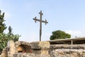 Metal cross on the ruins of the temple of Byzantine times in the territory catholic Christian Transfiguration Church located on Mo Royalty Free Stock Photo