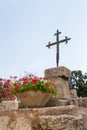 Metal cross on the ruins of the temple of Byzantine times in the territory catholic Christian Transfiguration Church located on