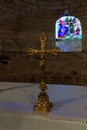 The golden crucifix stands on a table in the lower hall of the St. Josephs Church in Nazareth, northern Israel