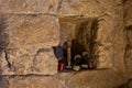 The niche with candles in a stone wall in the church - synagogue in Nazareth, northern Israel Royalty Free Stock Photo