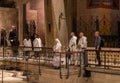 Monks after finishing the prayer enter the main altar of Church of the Annunciation in the Nazareth city in northern Israel Royalty Free Stock Photo