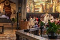 Monks leave the main altar at the end of the general worship with the faithful on the top floor of the of Church of the