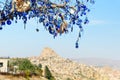 Nazars, Turkish Evil eye charms on the tree. Cappadocia. Turkey