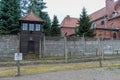 Nazi watch tower by barbed wire fencing at the Auschwitz concentration camp