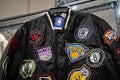 NBA jacket with multiple basketball team logos on display in store. Royalty Free Stock Photo