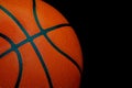 Nba size leather basketball on dark background Royalty Free Stock Photo