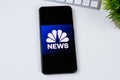 NBC News app logo on a smartphone screen. Royalty Free Stock Photo