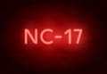 NC-17 rating sign. Vector neon sign on brick illuminated wall