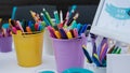 Nchildren`s drawing school, children`s creativity with brushes and felt-tip pens close-up.
