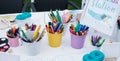 Nchildren`s drawing school, children`s creativity with brushes and felt-tip pens close-up.