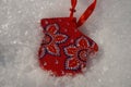 Christmas red mitten in the snow Royalty Free Stock Photo