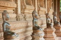 Ncient copper Buddha statues located outside of the Hor Phra Keo temple former temple of the Emerald Buddha in Vientiane, Laos.