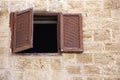 ÃÂncient window with shutters in a stone house Royalty Free Stock Photo