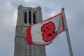 NCSU flag and bell tower.