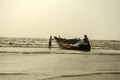 2nd February, 2022, Mandarmani, East Midnapur, West Bengal, India: A wooden lonely fishing boat with few fishermen on Digha sea