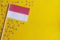 Ndonesia Independence Day. Flag of Indonesia on a festive yellow background. The concept of celebration, patriotism and Royalty Free Stock Photo
