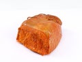 Nduja, inside its sausage casing, on white background. It is a trditional spicy, spreadable pork sausage