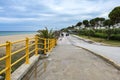 Nea Moudania, Greece, May 3, 2023: Beach promenade at the Mediterranean Sea, tourist destination in the Greek village of Nea